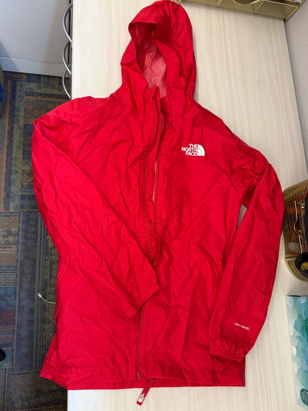 The North Face Red waterproof windbreaker jacket